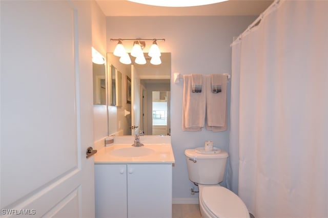 bathroom featuring vanity and toilet