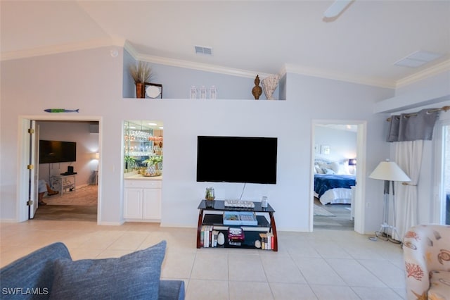 living room with lofted ceiling, crown molding, and light tile patterned floors