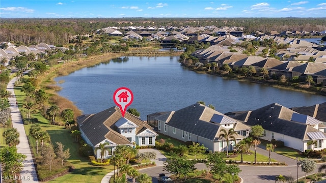 drone / aerial view with a water view