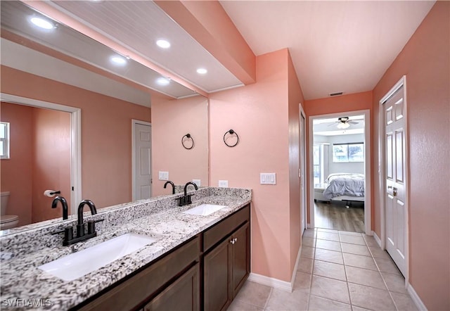 bathroom featuring ceiling fan, tile patterned flooring, vanity, and toilet