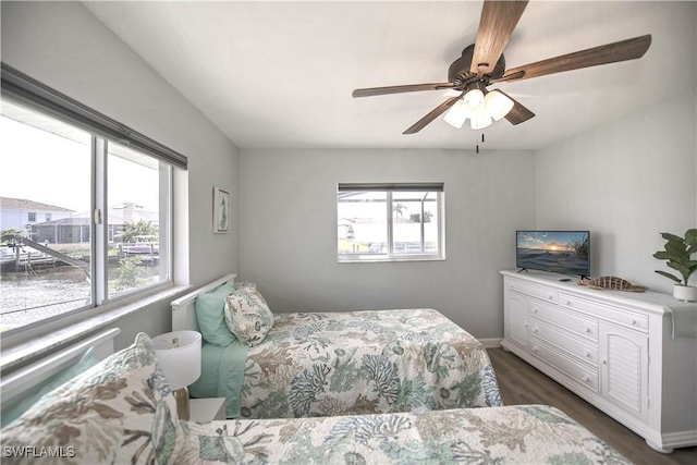 bedroom featuring dark hardwood / wood-style floors and ceiling fan