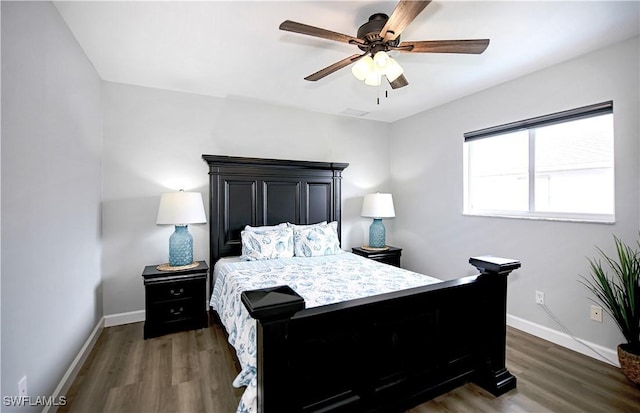 bedroom featuring dark hardwood / wood-style floors and ceiling fan