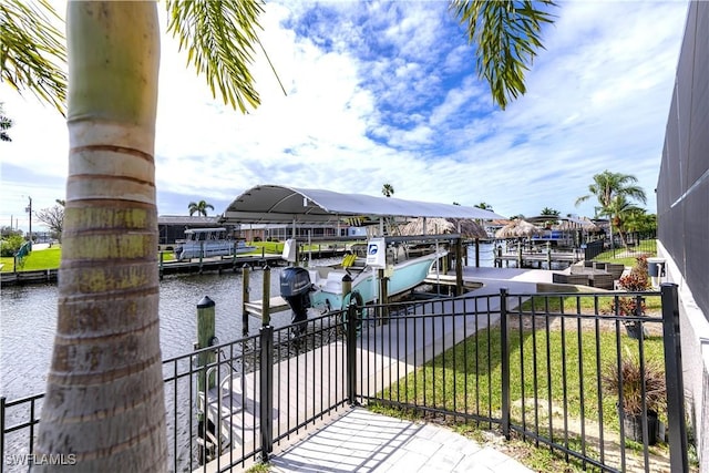 exterior space featuring a water view and a dock