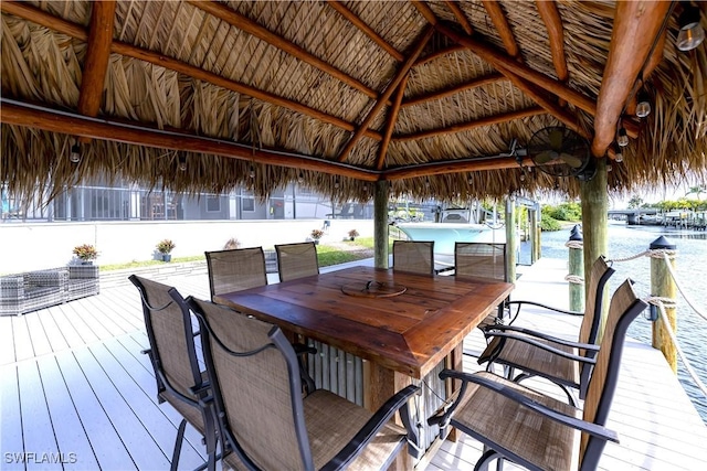 deck featuring a gazebo and exterior bar