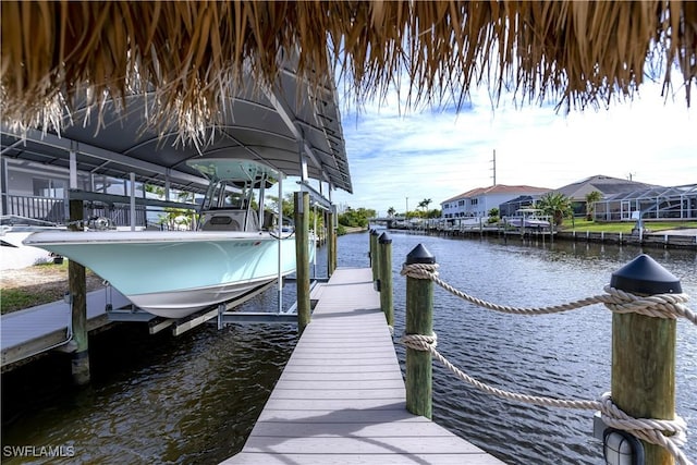 dock area featuring a water view and boat lift