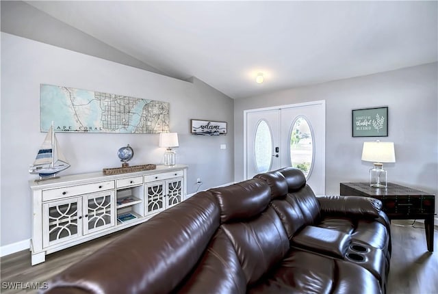 living room featuring french doors, dark hardwood / wood-style flooring, and lofted ceiling