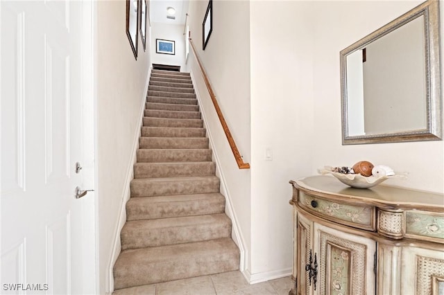 stairs with tile patterned flooring