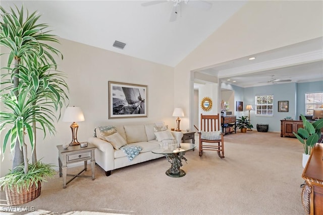 carpeted living room featuring ceiling fan