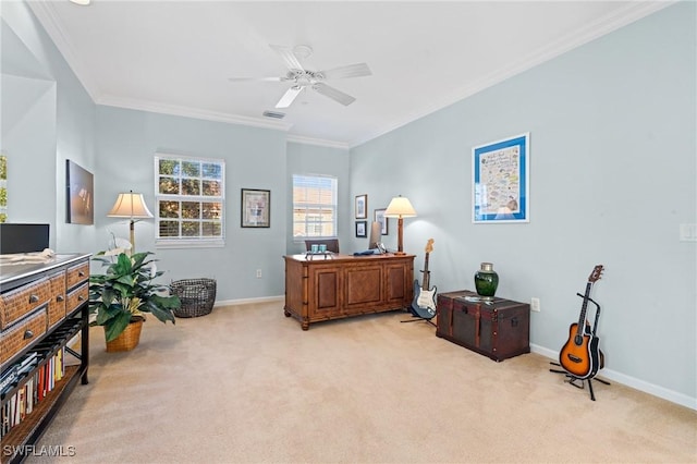 carpeted home office with ceiling fan and crown molding