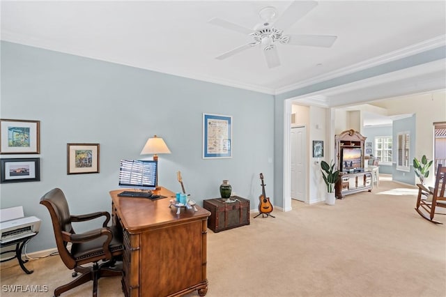 office with ceiling fan, light colored carpet, and crown molding