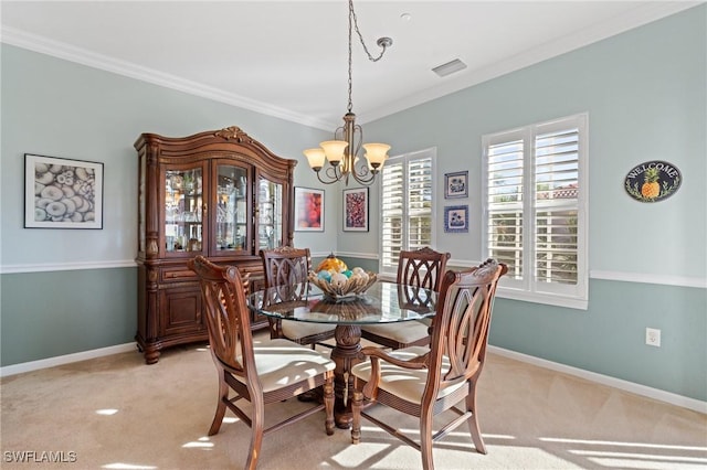 dining room featuring light colored carpet, crown molding, and a chandelier