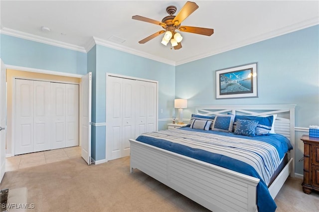 bedroom featuring light carpet, a closet, ceiling fan, and ornamental molding