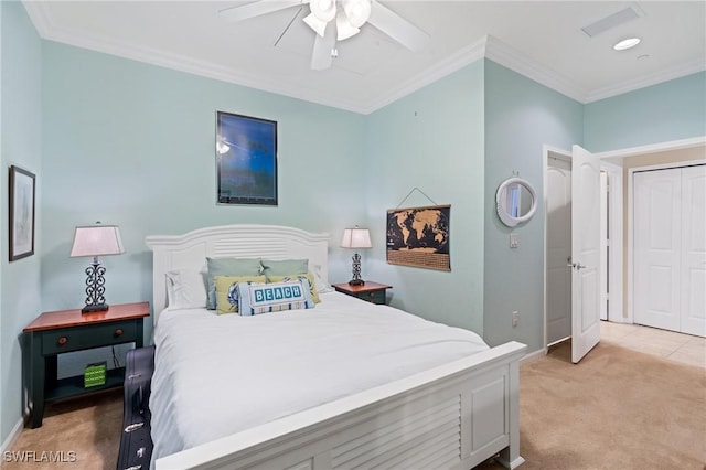 carpeted bedroom featuring a closet, ceiling fan, and ornamental molding