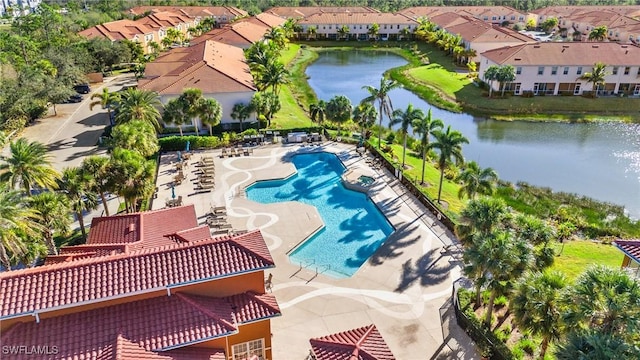 bird's eye view featuring a water view and a residential view