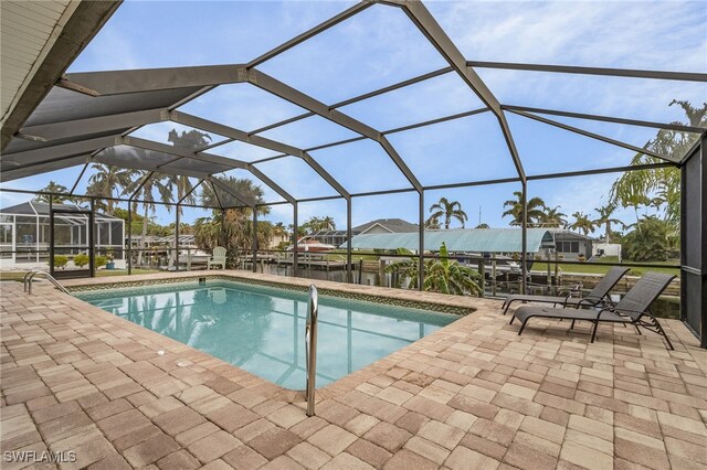 view of pool with a lanai and a patio area