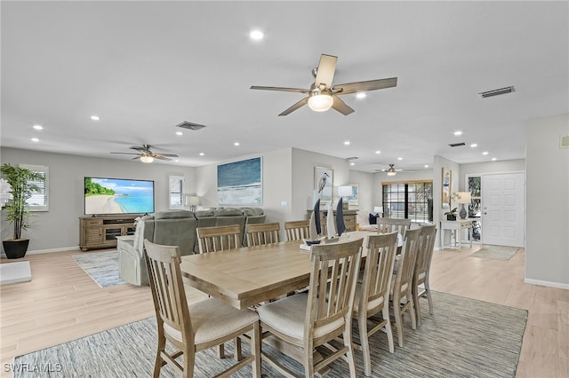 dining space featuring ceiling fan and light hardwood / wood-style floors