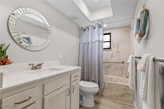 full bathroom featuring hardwood / wood-style flooring, vanity, toilet, and shower / bath combo