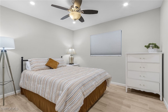 bedroom with ceiling fan and light wood-type flooring