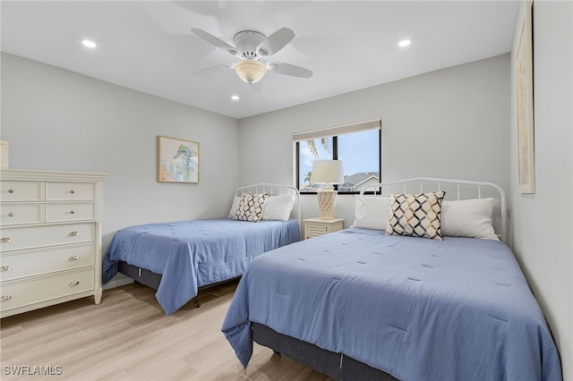 bedroom featuring light wood-type flooring and ceiling fan