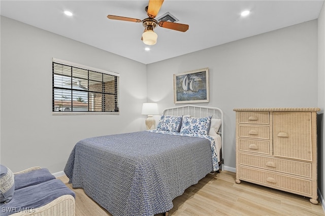 bedroom with ceiling fan and light wood-type flooring