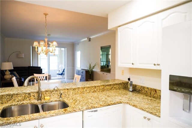 kitchen with dishwasher, pendant lighting, white cabinetry, and sink