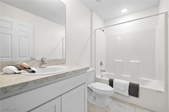 full bathroom featuring tile patterned flooring, vanity, bathtub / shower combination, and toilet