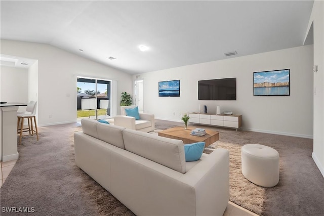 carpeted living room with lofted ceiling