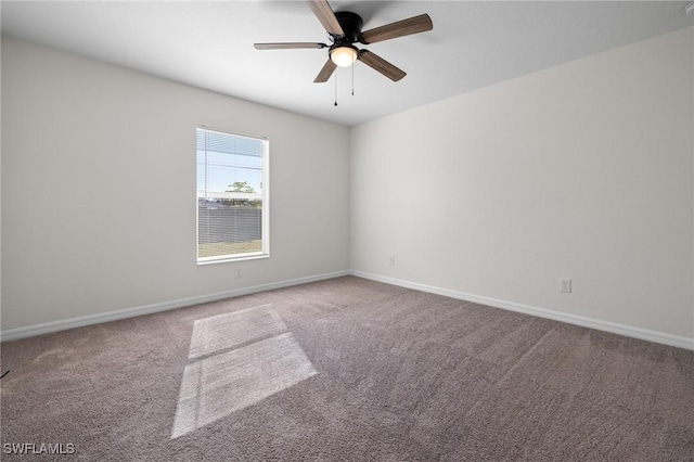 unfurnished room featuring light colored carpet and ceiling fan