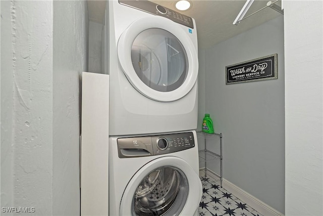 laundry room featuring stacked washer and dryer