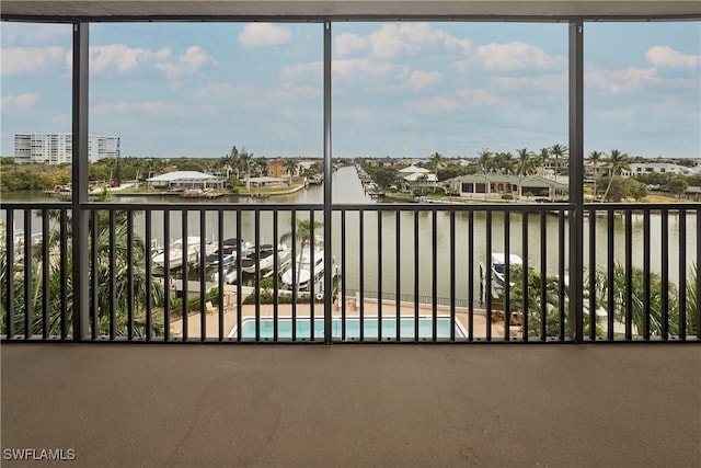 unfurnished sunroom with a water view and plenty of natural light