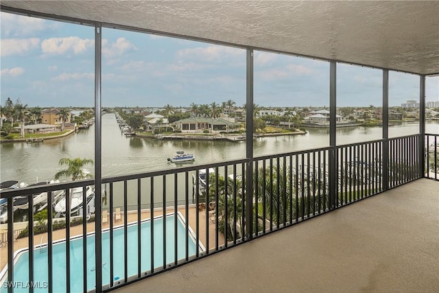 unfurnished sunroom with a water view