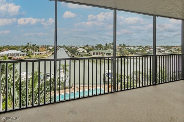 unfurnished sunroom with a water view