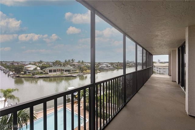 balcony featuring a water view