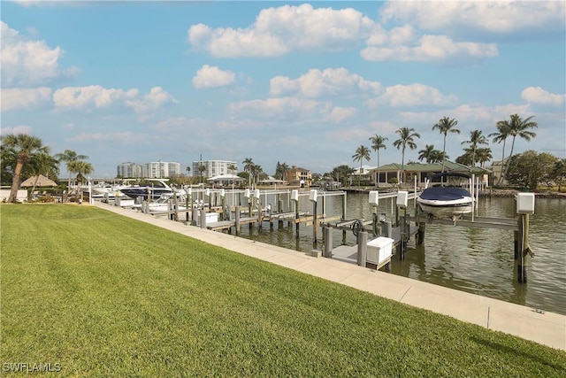 view of dock featuring a yard and a water view