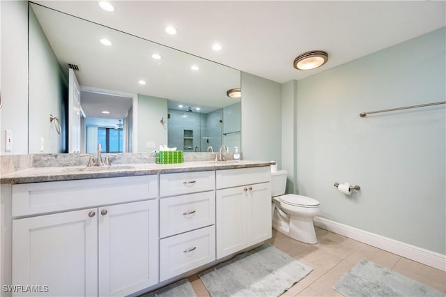 full bath with double vanity, a stall shower, a sink, and visible vents