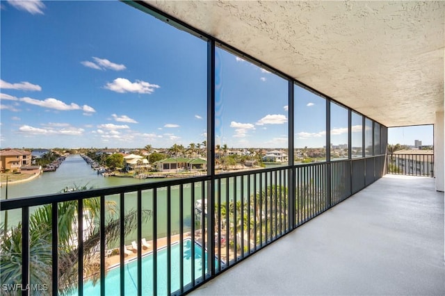 balcony featuring a water view