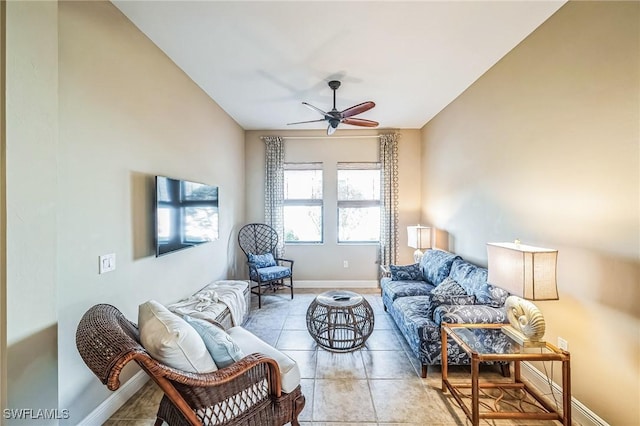 tiled living room with ceiling fan