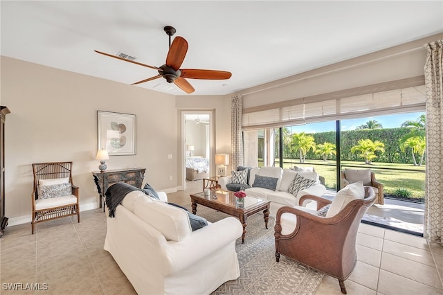 tiled living room featuring ceiling fan