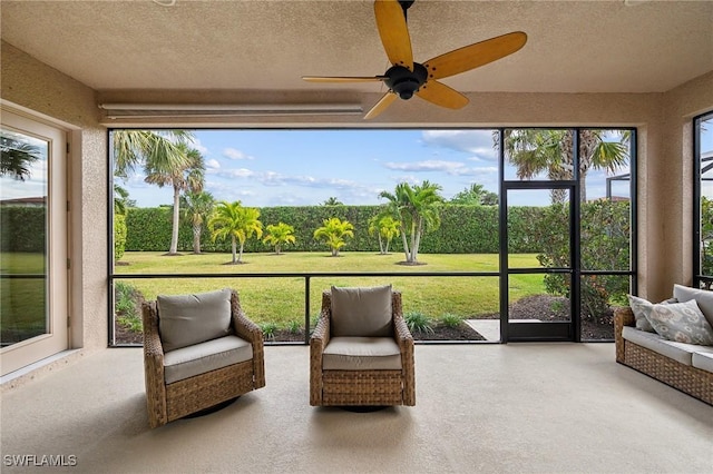 sunroom with ceiling fan