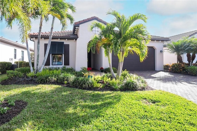 mediterranean / spanish-style house featuring a front yard