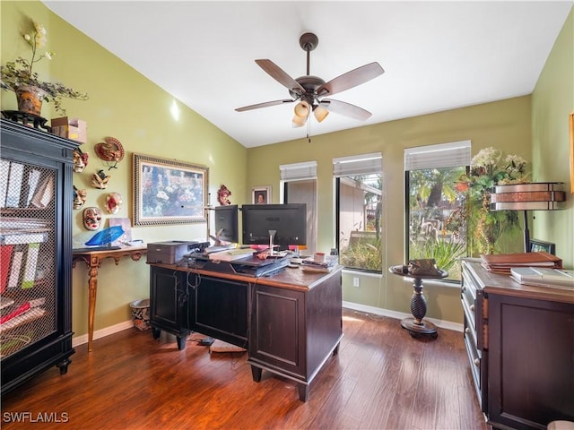 home office with ceiling fan, dark wood-type flooring, and lofted ceiling