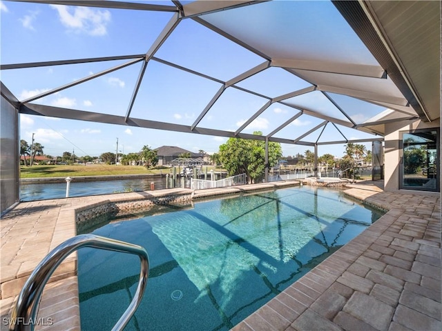 view of swimming pool featuring glass enclosure, a water view, and a patio