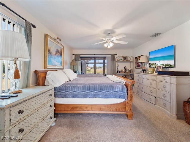 bedroom featuring ceiling fan and carpet floors