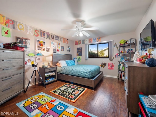 bedroom with ceiling fan and dark hardwood / wood-style floors