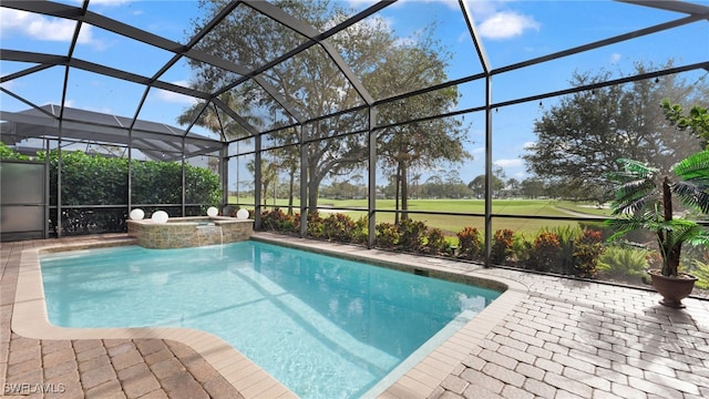 view of pool with glass enclosure and an in ground hot tub