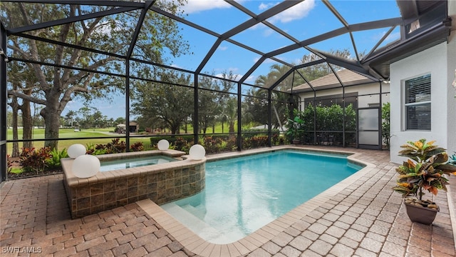 view of pool with glass enclosure, an in ground hot tub, and a patio