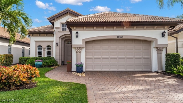 mediterranean / spanish house featuring a garage