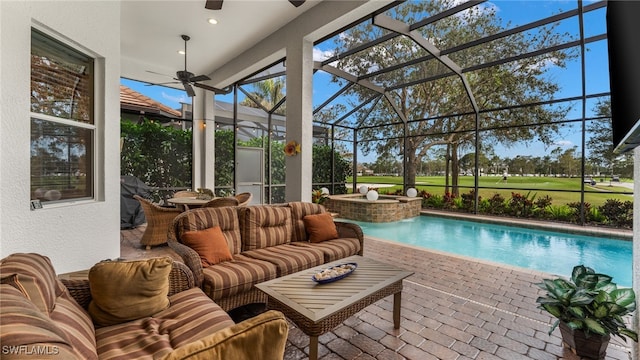 view of swimming pool with an outdoor hangout area, a patio area, ceiling fan, and a lanai