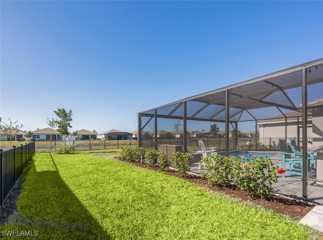 view of yard featuring glass enclosure and a fenced in pool