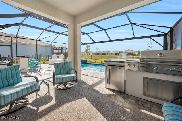 view of patio / terrace featuring outdoor lounge area, an outdoor kitchen, a grill, and a lanai